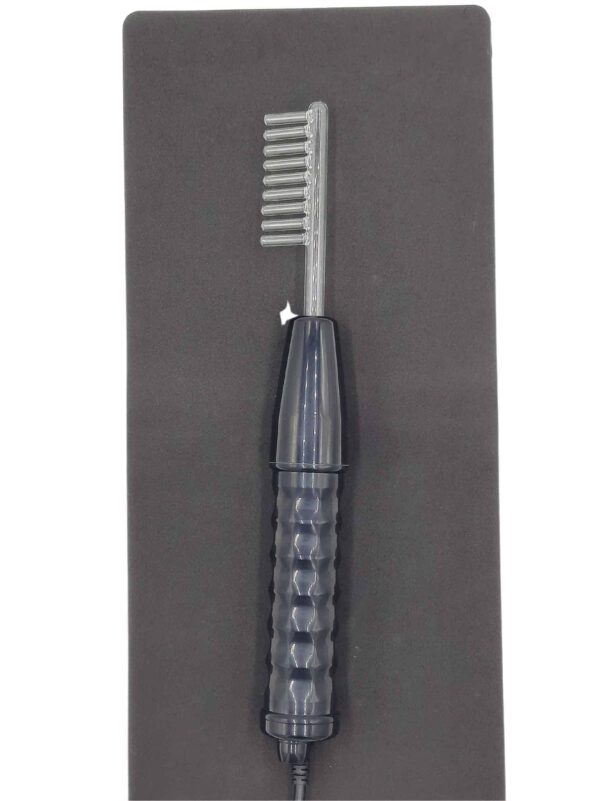 Glass comb attachment inside a violet wand