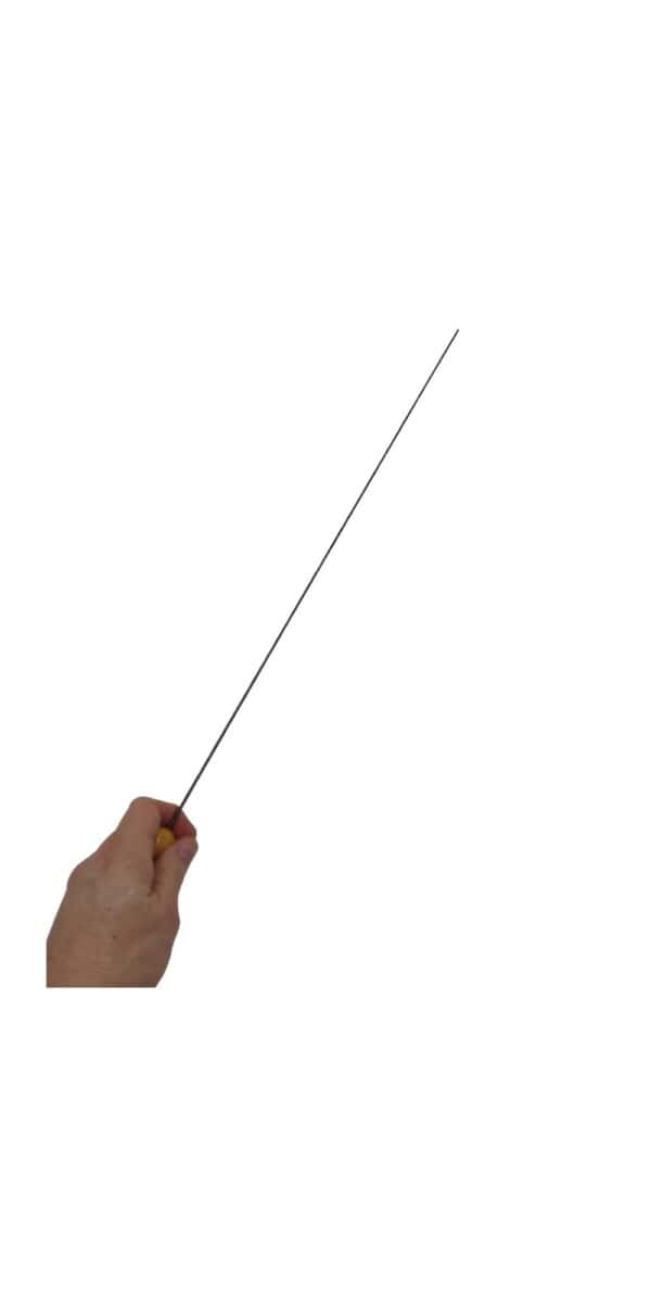 A hand holding a black carbon fiber bdsm evil stick for spanking on a white background