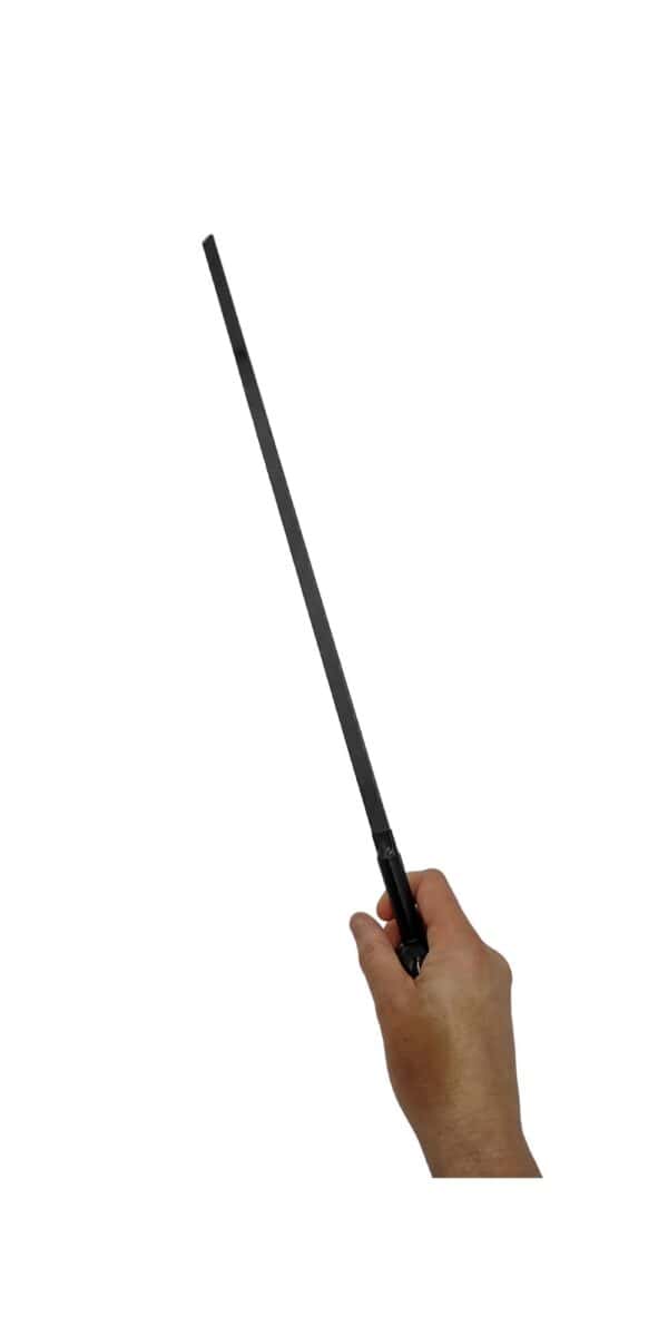 A person's hand wielding a Black Carbon Fiber BDSM Discipline Paddle at a 45 degree angle