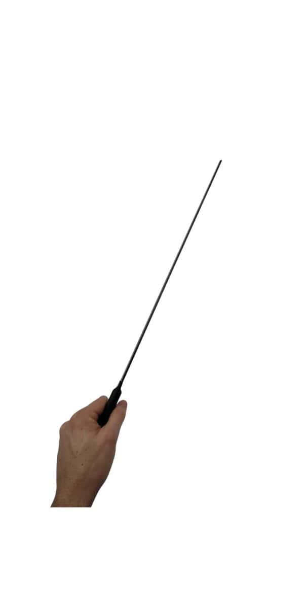 A hand holding a black carbon fiber discipline cane with on a white background