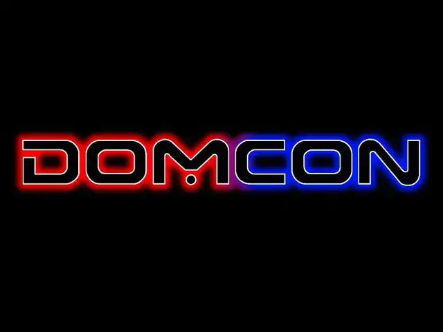 Red and Blue Domcon logo on black background